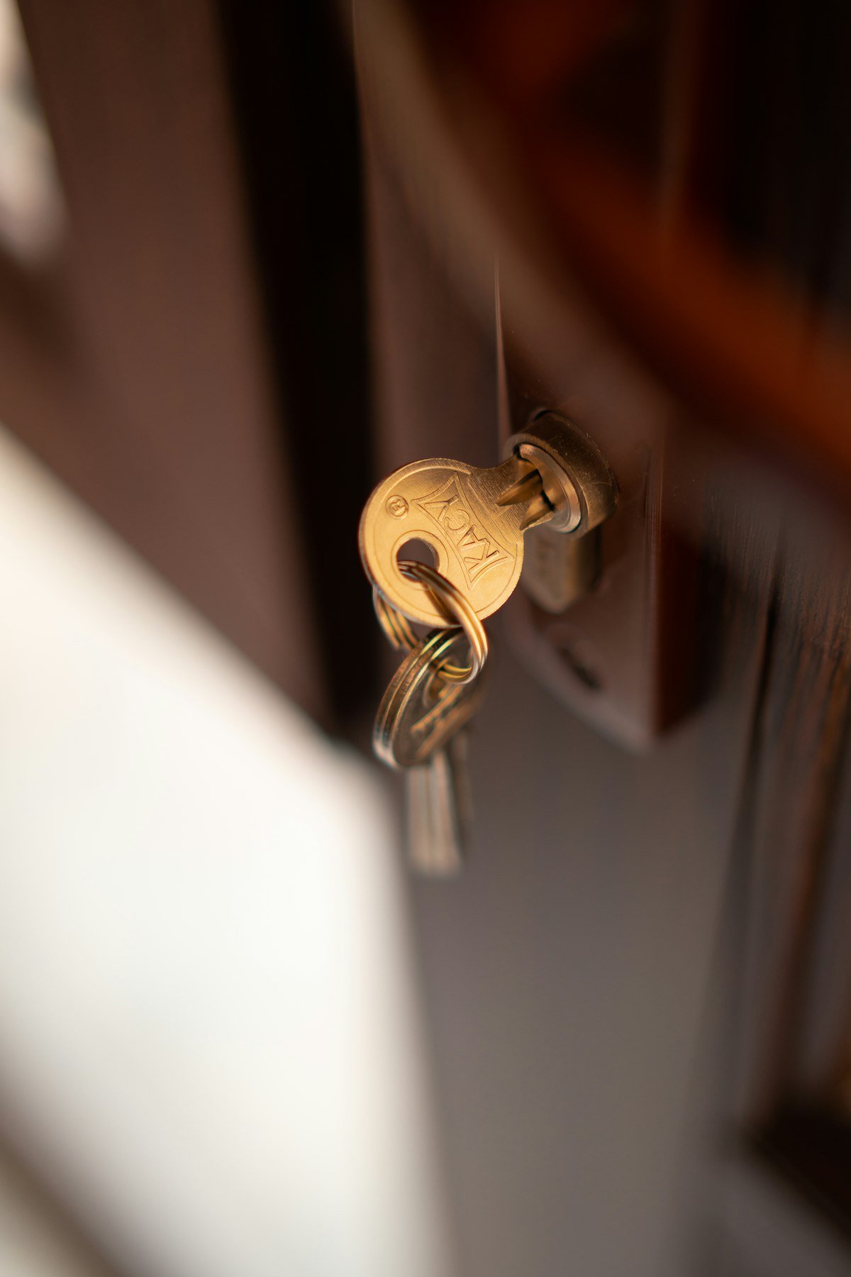 House key in a front door lock – residential locksmith services